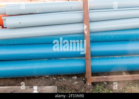 Plastic pipes with grooves on the construction site Stock Photo