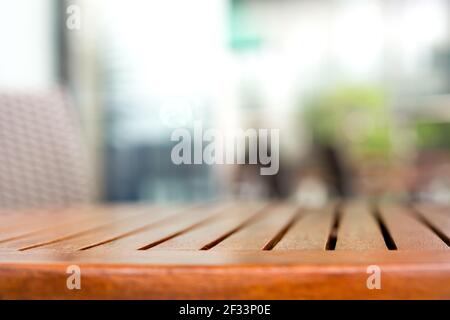 Empty round wood table top in outdoor cafe - can be used for display or mintage your products Stock Photo