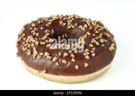Chocolate donut encrusted with nuts isolated on white Stock Photo