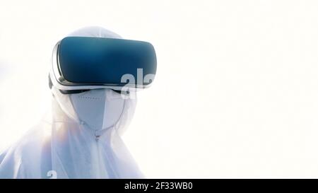 Virologist in full protective suit using vr glasses in research. High quality photo Stock Photo
