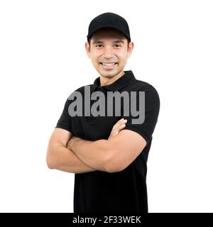 Smiling man in black uniform standing with arm crossed - isolated on white background Stock Photo