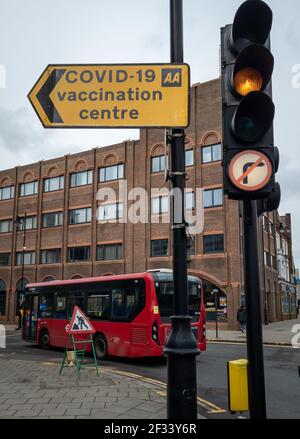 A road direction sign from the AA pointing out the way to a Covid-19 vaccination centre. Stock Photo