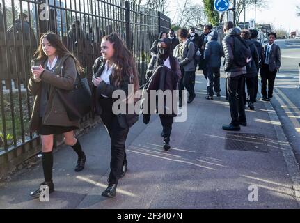 Pupils of a secondary school going home after school. Stock Photo