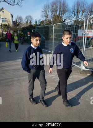 Parents on the school run taking their children to school. Stock Photo