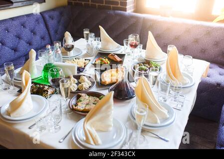 Assortment different Georgian dishes for the company. Table setting Stock Photo