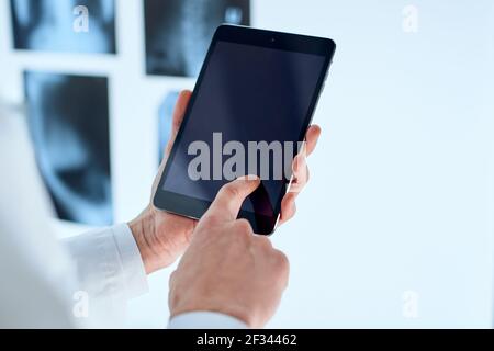 attending physician is using a digital tablet. Stock Photo