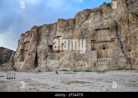 Naqsh-e Rostam ancient necropolis near Persepolis in Iran. From left to right are the tombs of the kings Darius II, Artaxerxes I and Darius the Great Stock Photo
