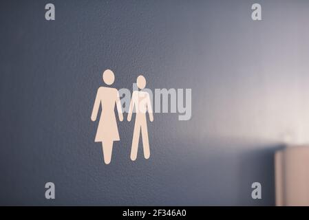 bathroom symbol of man and woman on blue door Stock Photo