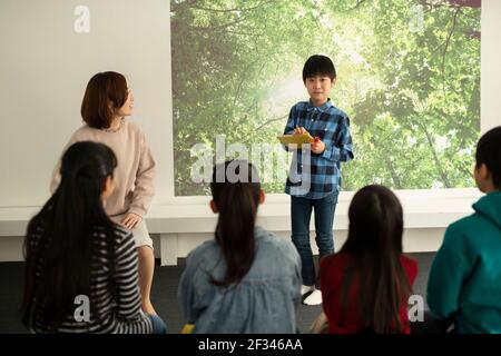 Child Giving Presentation Stock Photo