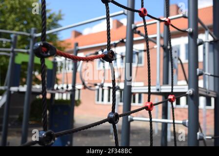 Climbing frame at a playground on schoolyard Stock Photo
