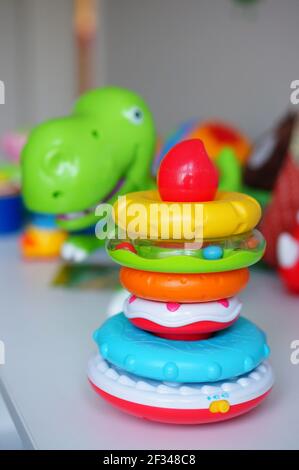 Stack of colorful toy rings on a table Stock Photo