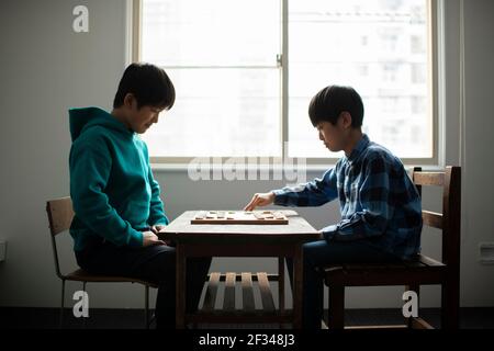 Elementary School Students as Shogi (Japanese Chess) Players Stock Photo