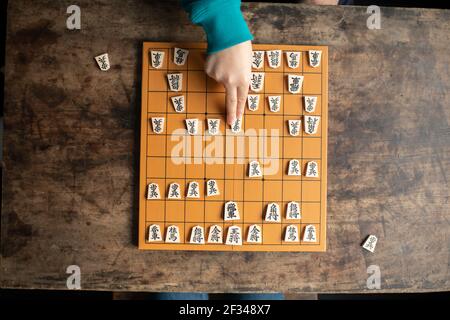 Elementary School Student as a Shogi (Japanese Chess) Player Stock Photo