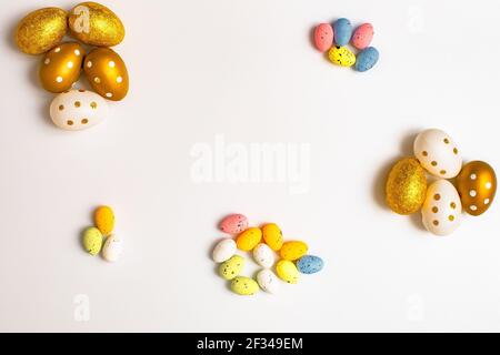 Easter Egg bottom border over a soft white banner background. Top down view with copy space. Stock Photo
