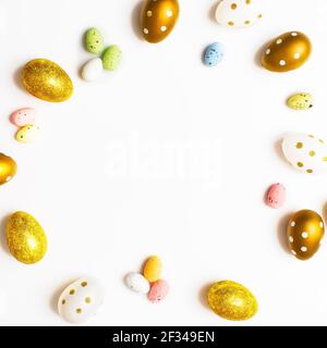 Easter Egg bottom border over a soft white banner background. Top down view with copy space. Stock Photo