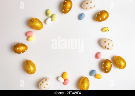 Easter Egg bottom border over a soft white banner background. Top down view with copy space. Stock Photo