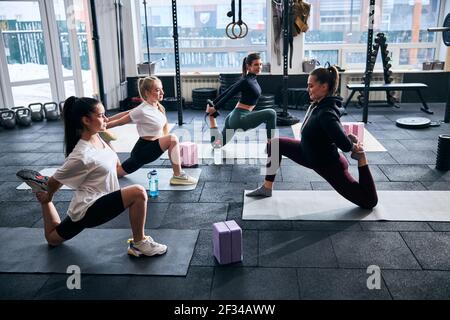 Flexible ladies maintaining their muscles in perfect shape Stock Photo
