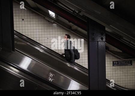 New york subway escalator man going up Stock Photo