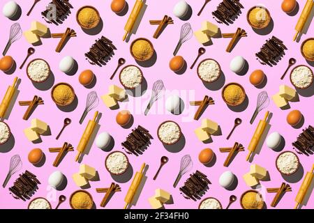 Baking background. Pattern of raw ingredients for cooking dessert on a pink background. Stock Photo