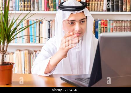 Aarabic muslim man using online technology Stock Photo