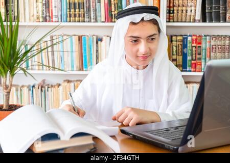 Arabic Muslim student studying online Stock Photo