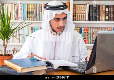 Arabic Muslim student studying online Stock Photo