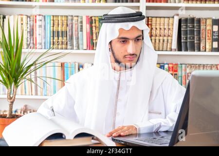 Arabic Muslim student studying online Stock Photo