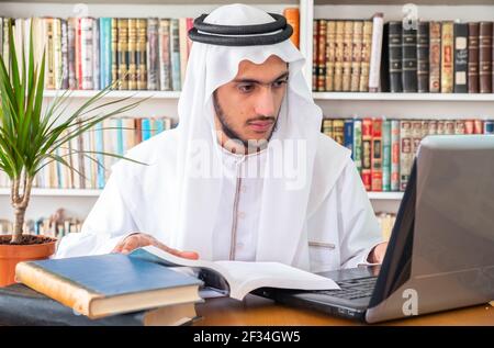 Arabic Muslim student studying online Stock Photo