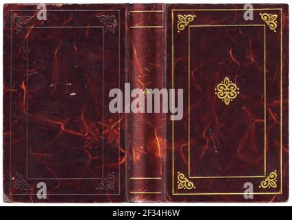 Old open book in textured polished crimson red leather cover with abstract embossed golden decorations - nice details! Stock Photo