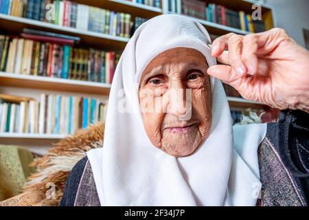 Arabic muslim man praying for god using rosary Stock Photo