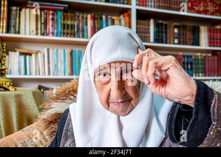 Arabic muslim man praying for god using rosary Stock Photo
