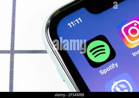 Sankt-Petersburg, Russia, March 8, 2021: Spotify app icon on Apple iPhone 11 smartphone screen closeup. Spotify logo application on modern phone Stock Photo