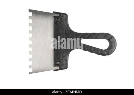 New trowel for tiles isolated on white background. Notched trowel isolated over white. Stock Photo