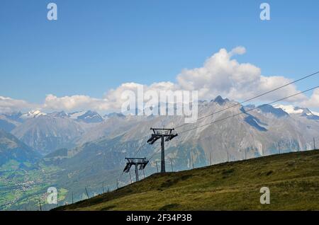 Austria, Tirol, cable car to Goldried mountain with view to Austrian Alps and village of Matrei in East-Tyrol Stock Photo