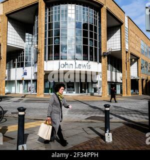 London UK, March 15 2021, John Lewis Department Store With A Person Walking By During Coronavirus Covid-19 Lockdown 2021 Stock Photo