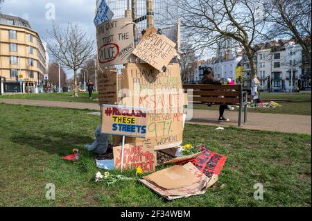 Brighton UK 15th March 2021 - Floral tributes and messages for murder victim Sarah Everard and some anti police messages left at Valley Gardens in Brighton where a candlelit vigil was held on Saturday :  Credit Simon Dack / Alamy Live News Stock Photo