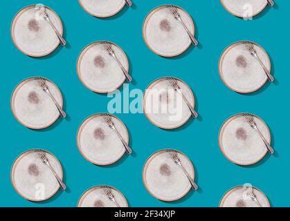 Empty plate and fork on a bright beautiful background, seamless pattern. Modern stylish design. Concept for menu with cutlery. Stock Photo