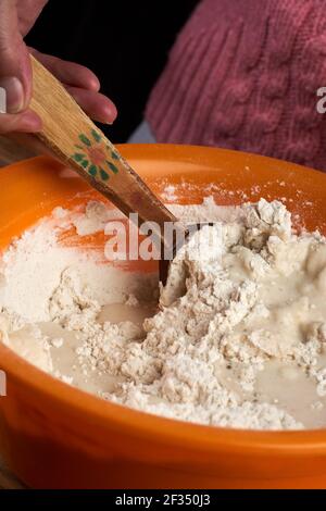 Closeup of making bread dough in a bowl Stock Photo