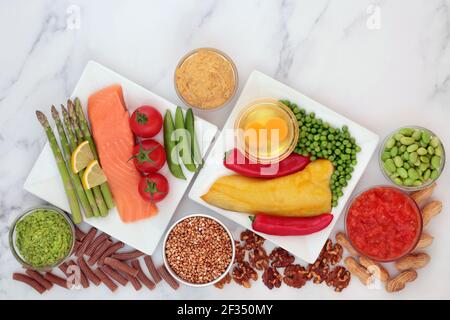 Low glycemic food for diabetics for a healthy diet with vegetables, seafood, grains, dairy, nuts,pasta & dips. All foods below 55 on the GI scale. Stock Photo