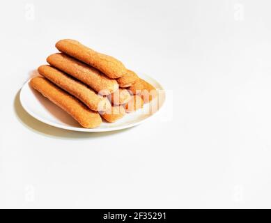 Sweet soft healthy soft spongy sprinkled sugar vanilla cookies (vainillas). Classic Argentine biscuits. White background. High angle shot. Copyspace Stock Photo