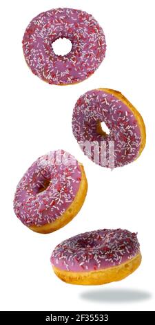 flying donuts isolated on white background. selective focus. multicolored crumpets. set of sweet doughnuts Stock Photo