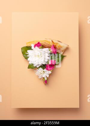 Spring floral concept with pizza and flowers Stock Photo