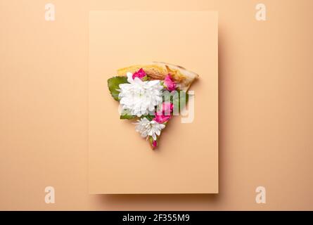 Spring floral concept with pizza and flowers Stock Photo