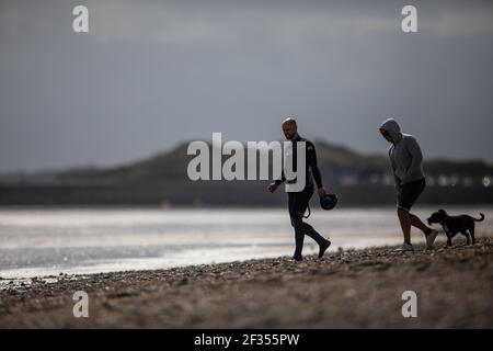 A windsurfer taking advantage of strong winds out on the water in Littlehampton, West Sussex Stock Photo