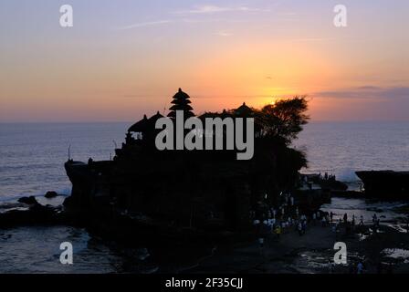 one of the most important Balinese temples Pura Tanah Lot is located on a cliff directly above the sea; in sunset, Bali, Indonesia Stock Photo