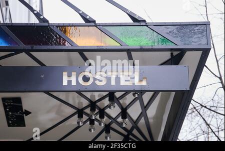 Berlin, Germany. 15th Mar, 2021. Hostel is written above the entrance of a hostel in Mitte. A year ago, the hospitality industry had to close nationwide. Credit: Annette Riedl/dpa/Alamy Live News Stock Photo
