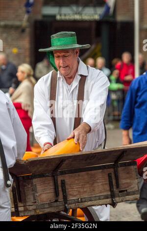 Cheese vendors in traditional costume at Alkmaar Cheese Market, Netherlands Stock Photo