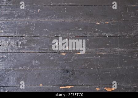 Weathered rustic and grungy black plank from table in top view for background Stock Photo