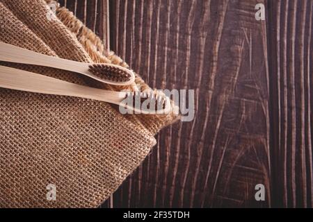 Eco-friendly bamboo teethbrushes on the wooden table. Zero waste. Top view Stock Photo