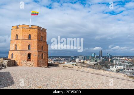 Gediminas Tower or Castle, the remaining part of the Upper Medieval Castle in Vilnius, Lithuania with Lithuanian flag Stock Photo